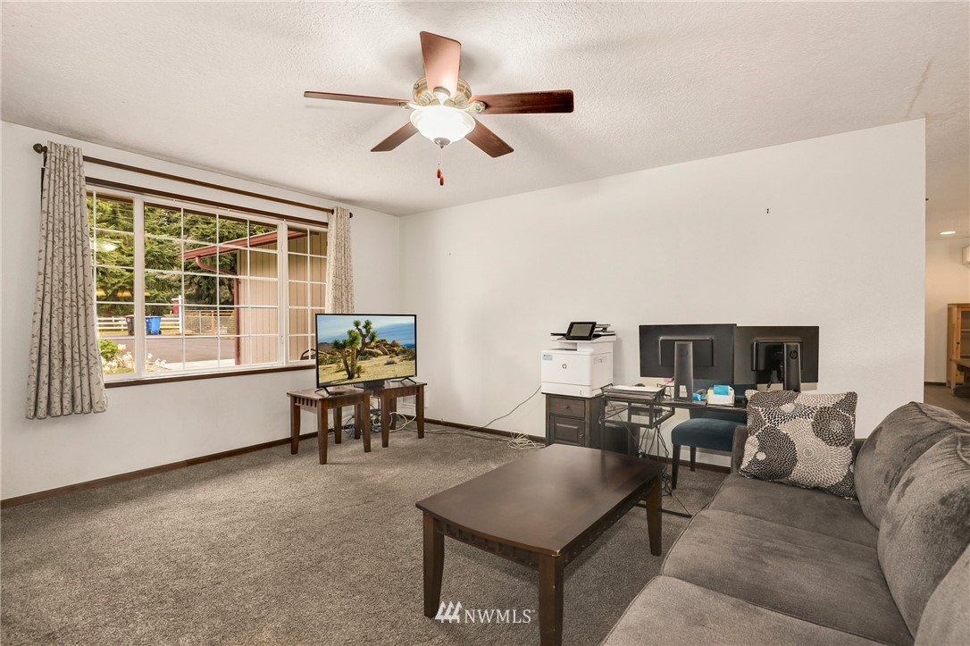 19206 Loganberry Street Southwest Rochester, WA 98579 - Photo 5 of 39 a living room with furniture and a window
