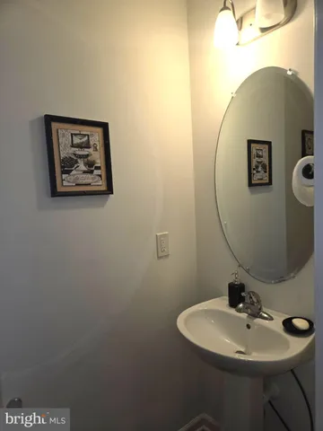 a bathroom with a sink and mirror