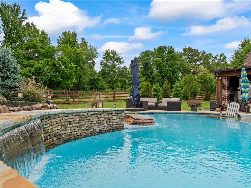 8104 Jack Bond Road Arlington, TN 38002 - Photo 31 of 40 a view of a swimming pool with a patio and a yard
