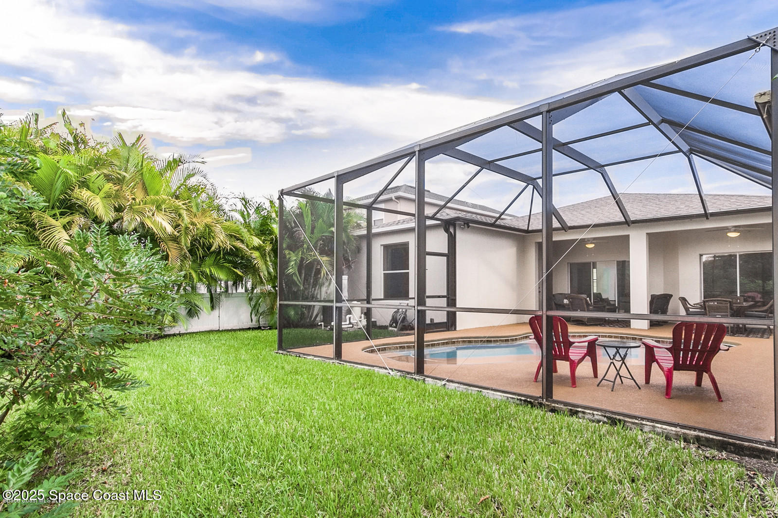 3180 Constellation Drive Melbourne, FL 32940 - Photo 14 of 18 swimming pool with table and chairs