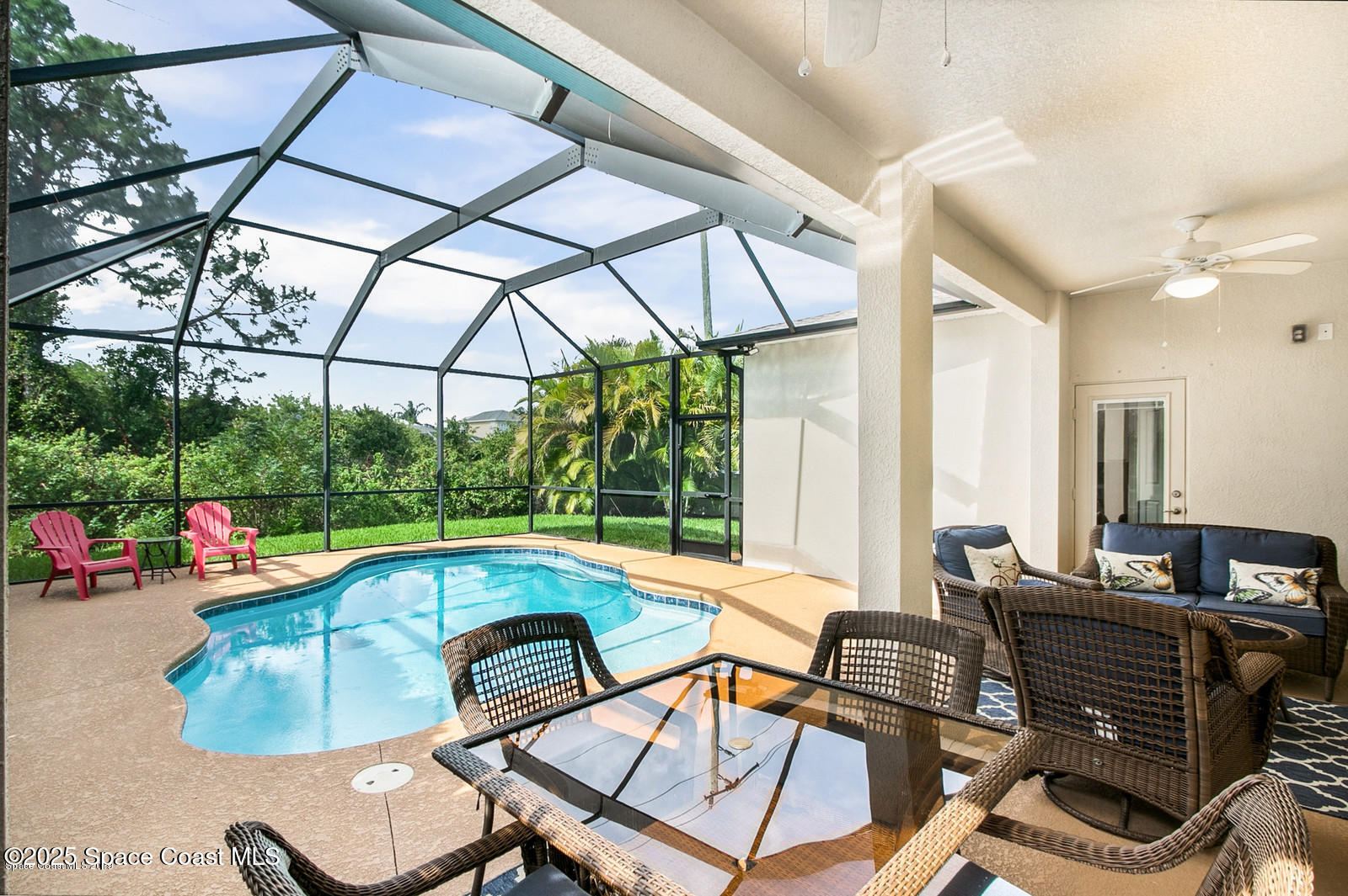3180 Constellation Drive Melbourne, FL 32940 - Photo 15 of 18 a living room with furniture and a floor to ceiling window