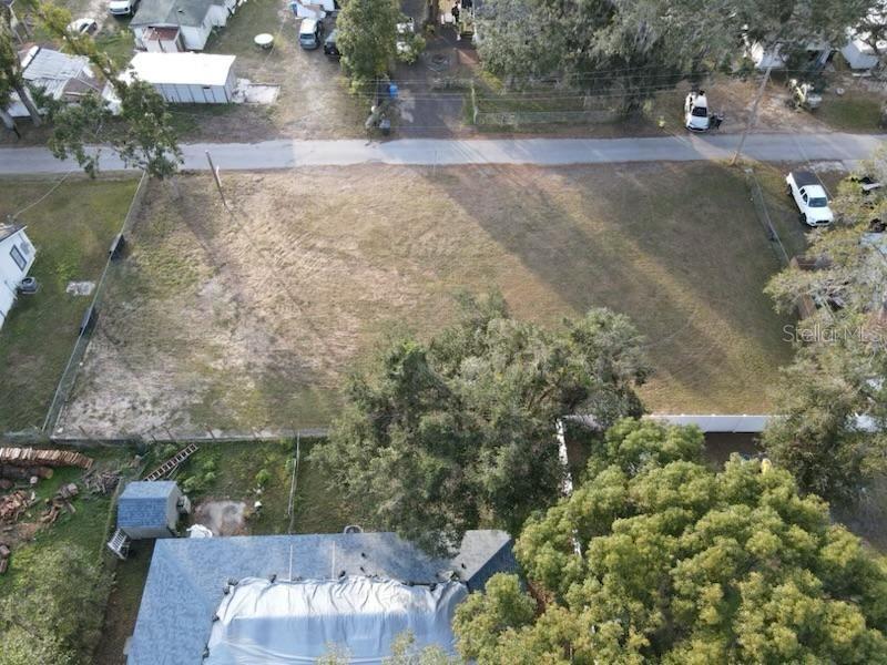 Lime Avenue Seffner, FL 33584 - Photo 4 of 6 an aerial view of a house with a yard and lake view