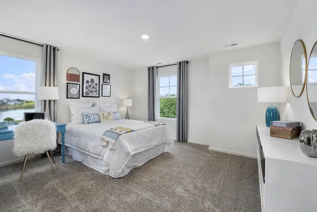 a bedroom with a bed and a couch