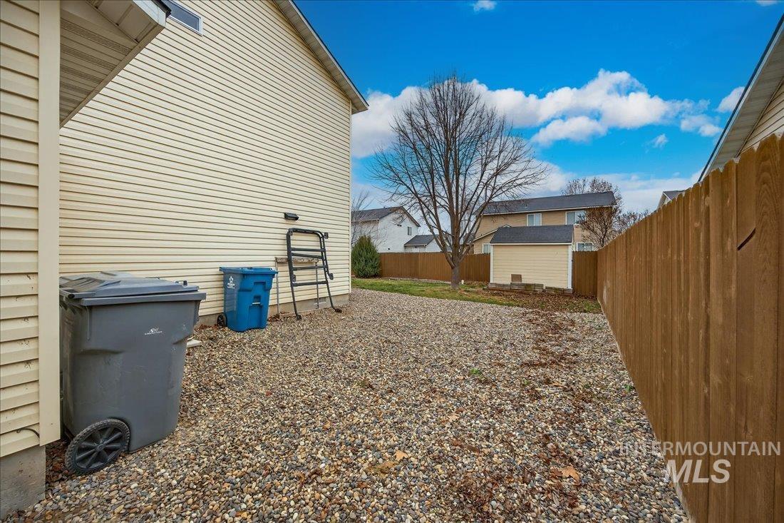 5106 Lathrop Place, Unit 19517 Caldwell, ID 83607 - Photo 5 of 29 Fenced backyard featuring an outdoor structure