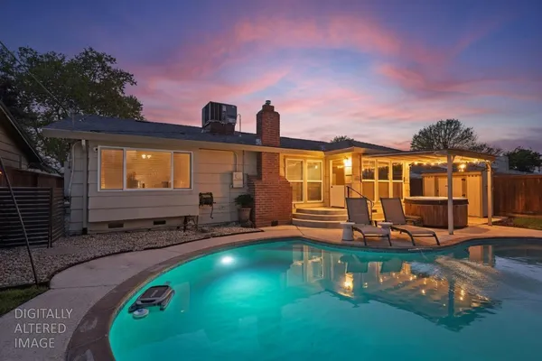 a view of a swimming pool with a patio