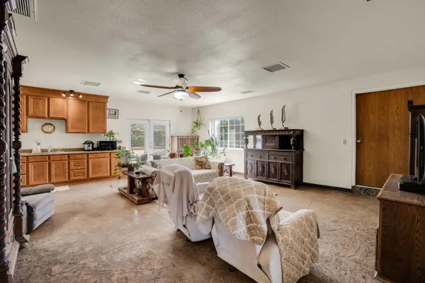 a bedroom with a bed and a couch