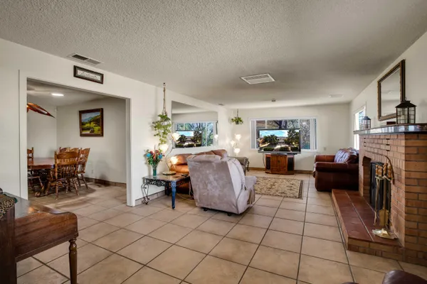 a kitchen with a sink a stove and chairs