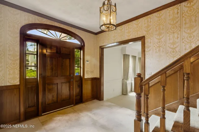 a spacious bathroom with a large tub shower and checkered floor