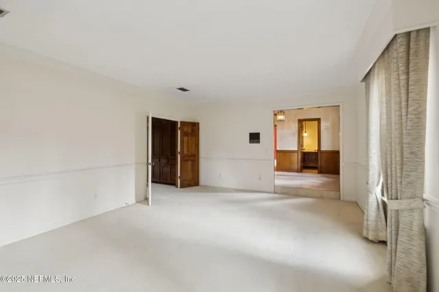 a kitchen with stainless steel appliances a sink and a large window