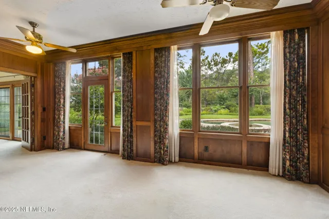 a view of a livingroom with a sofa and chandelier