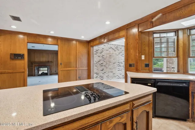 a view of staircase with white walls and windows