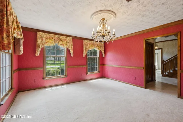 a bathroom with a bathtub and a window