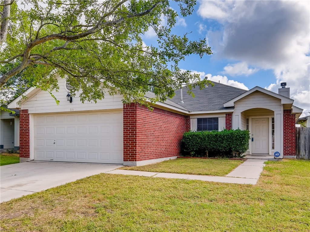 210 Bailey Loop Kyle, TX 78640 - Photo 1 of 1 a front view of a house with a yard