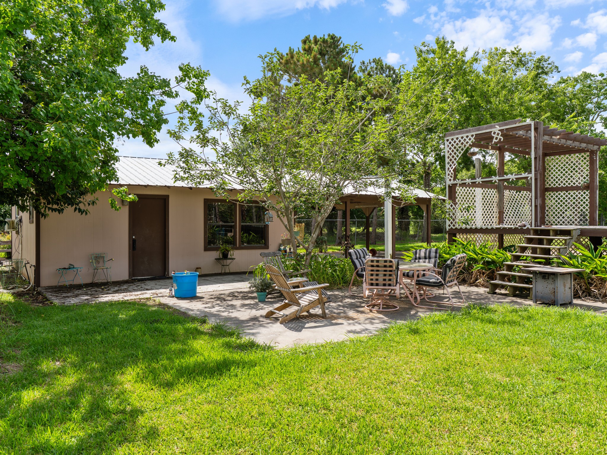 182 Smith Road Palacios, TX 77465 - Photo 23 of 23 a view of a backyard with sitting area and garden
