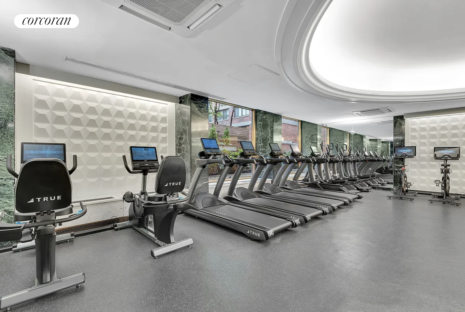 360 East 72nd Street, Unit C2003 Manhattan, NY 10021 - Photo 18 of 22 a view of a room with gym equipment