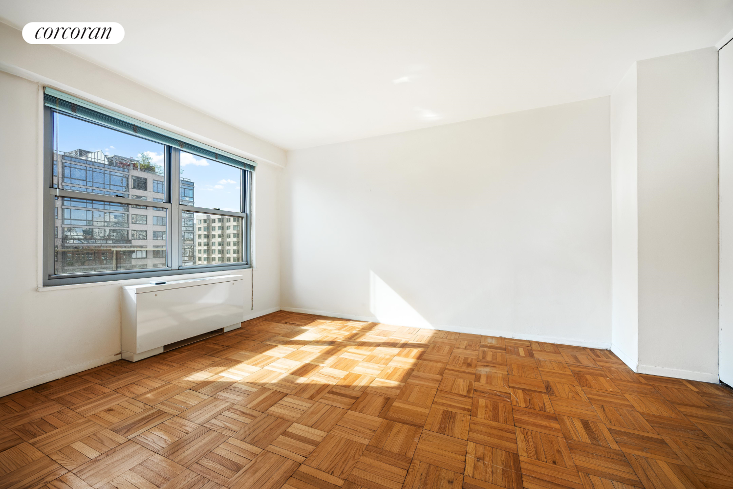 360 East 72nd Street, Unit C2003 Manhattan, NY 10021 - Photo 7 of 22 a bedroom with a bed and a window