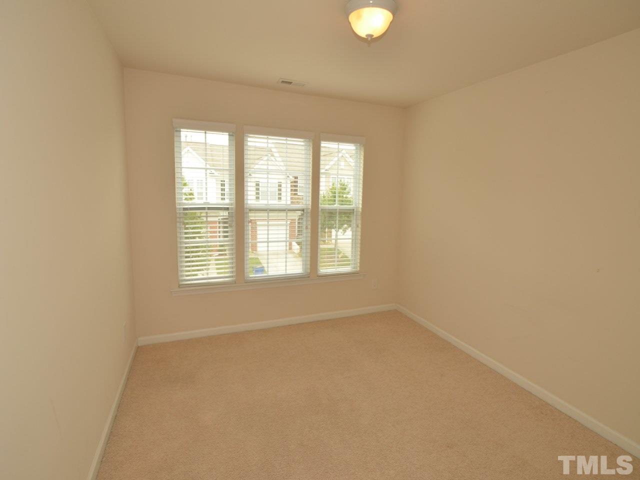8709 Owl Roost Place Raleigh, NC 27617 - Photo 13 of 25 13x10 front, second floor bedroom #3 is generously sized as well.