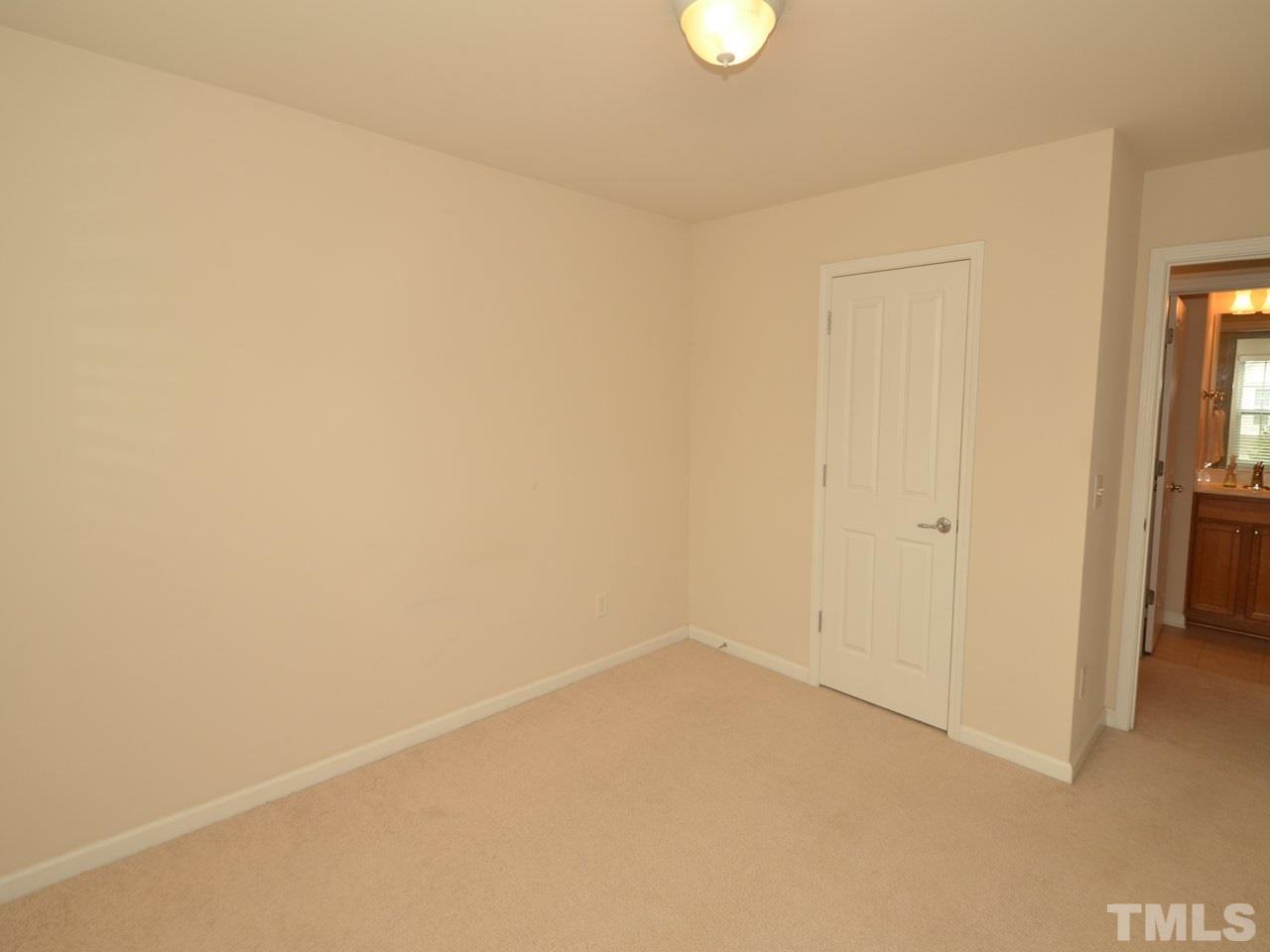 8709 Owl Roost Place Raleigh, NC 27617 - Photo 25 of 25 Elegant two-panel bead interior door with chrome finish lever door handles by Schlage®, smooth ceilings throughout and easy-access pull-down attic stairs. This popular Hemingway floor plan is known for its livability.
