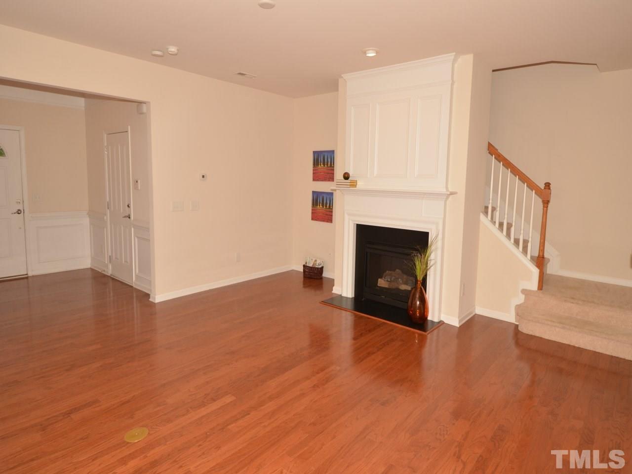 8709 Owl Roost Place Raleigh, NC 27617 - Photo 3 of 25 Grand foyer to the left is highlighted by chair railing and wainscoting. Coat closet is to the left.