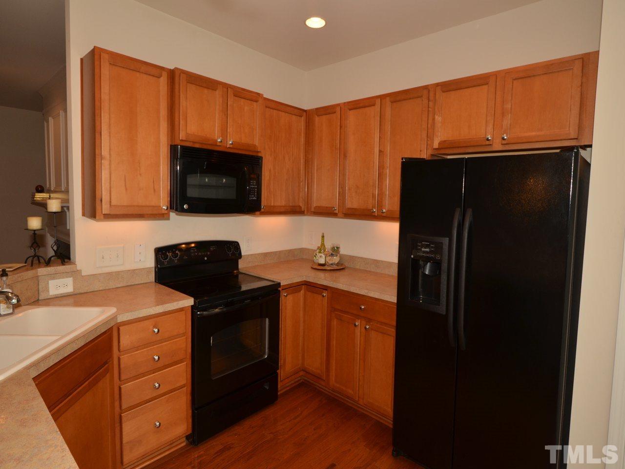 8709 Owl Roost Place Raleigh, NC 27617 - Photo 5 of 25 Double bowl, angled sink allows the chef to stay in the conversations. Dishwasher to the left and bank of drawers to the right to give ample room to move about and enjoy the optimal HGTV ‘work triangle’ layout. Very convenient.