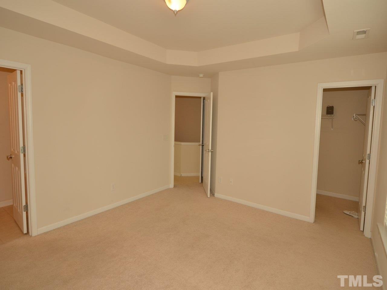 8709 Owl Roost Place Raleigh, NC 27617 - Photo 9 of 25 Walk-in closet to the right. Linen closet in the hallway (middle door) and private bath entry to the left.