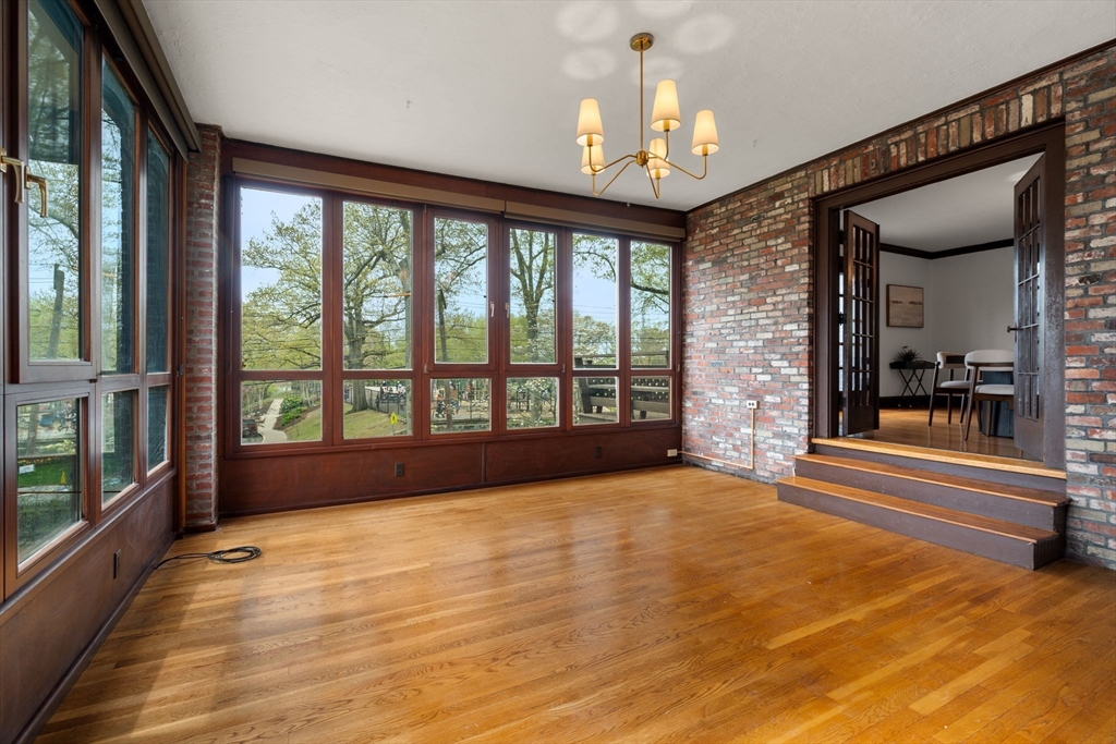 110 Wallis Road Chestnut Hill, MA 02467 - Photo 11 of 29 a view of empty room with wooden floor and fan