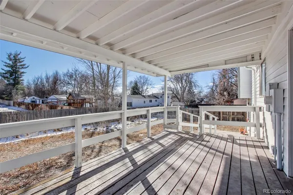 a view of balcony with wooden floor