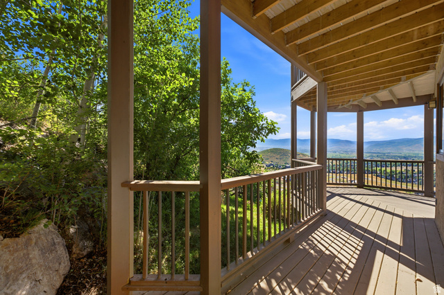 335 Bern Way Midway, UT 84049 - Photo 57 of 88 Expansive outdoor deck featuring wood-finish flooring, a full railing system, and supporting columns