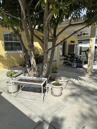 a view of a chairs and tables in the patio