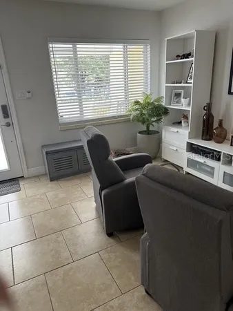 a living room with furniture and a window
