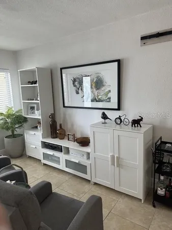 a view of living room filled with furniture and window