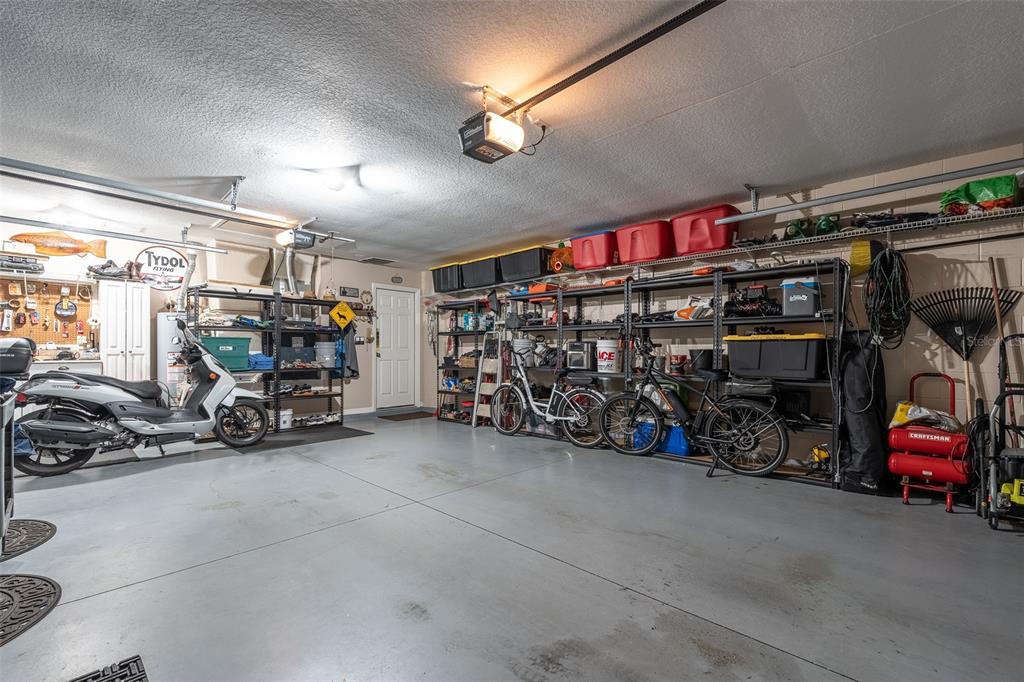 15525 Southwest 14th Avenue Road Ocala, FL 34473 - Photo 56 of 75 a view of a garage with parked cars
