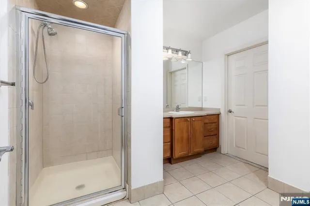 a bathroom with a sink double vanity and a mirror