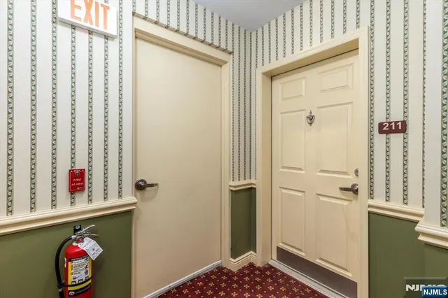 a bathroom with a door and a shower