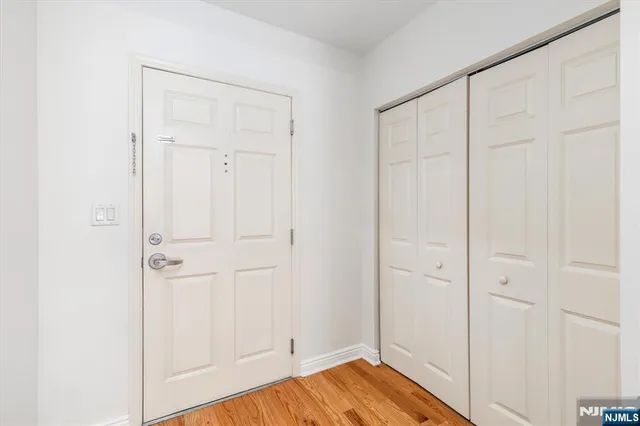 an empty room with wooden floor