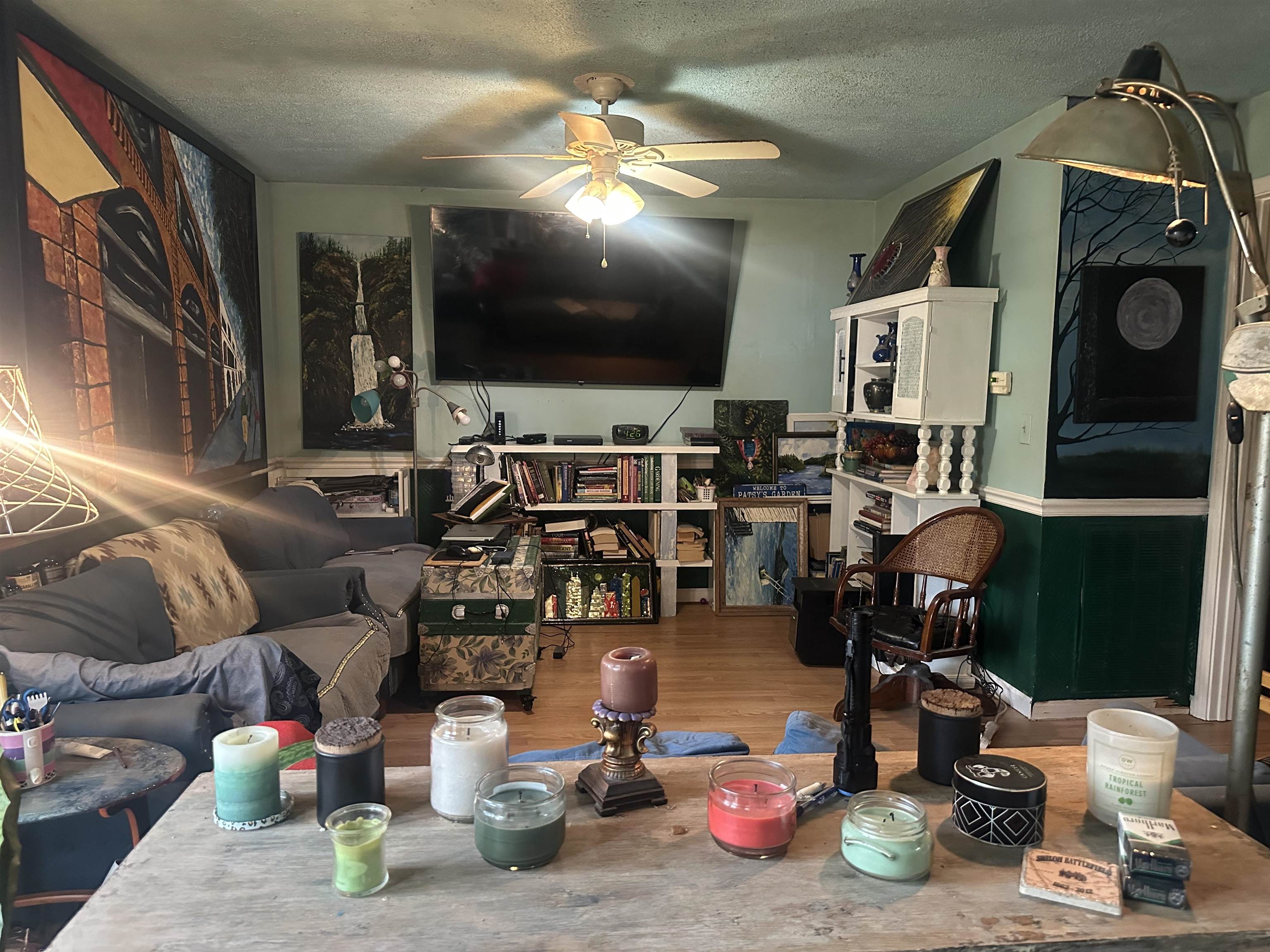5865 Enville Road Henderson, TN 38340 - Photo 16 of 24 a living room with lots of furniture and clutter