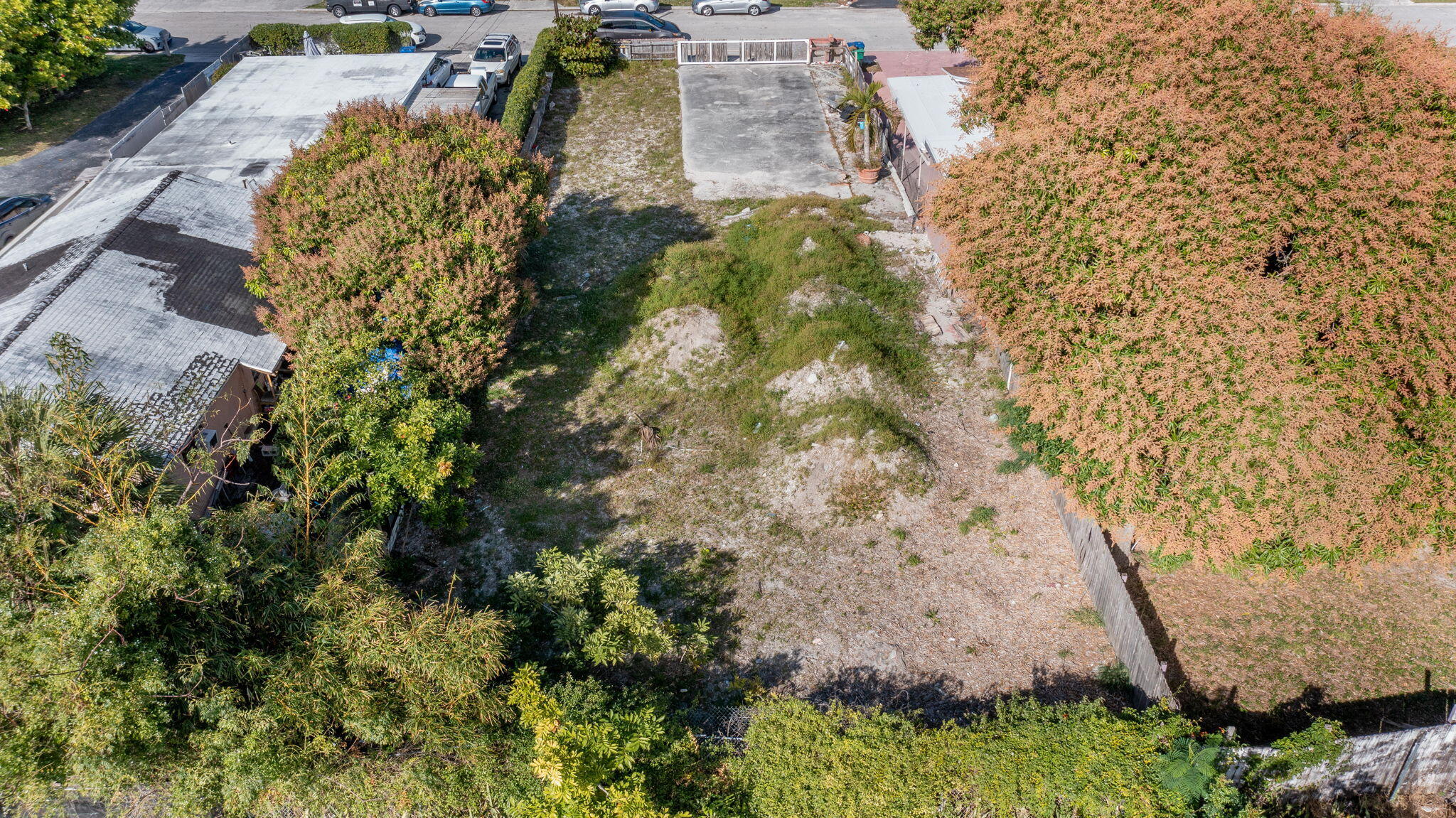 1045 West 30th Street Riviera Beach, FL 33404 - Photo 3 of 5 a aerial view of a house with a yard