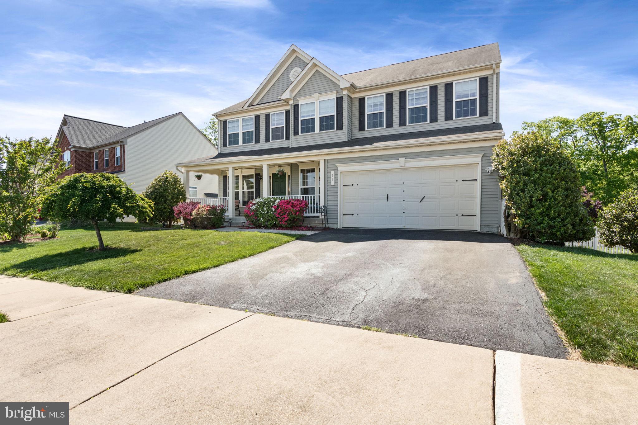 18 Dewitt Road Stafford, VA 22554 - Photo 3 of 73 a front view of a house with a yard and garage