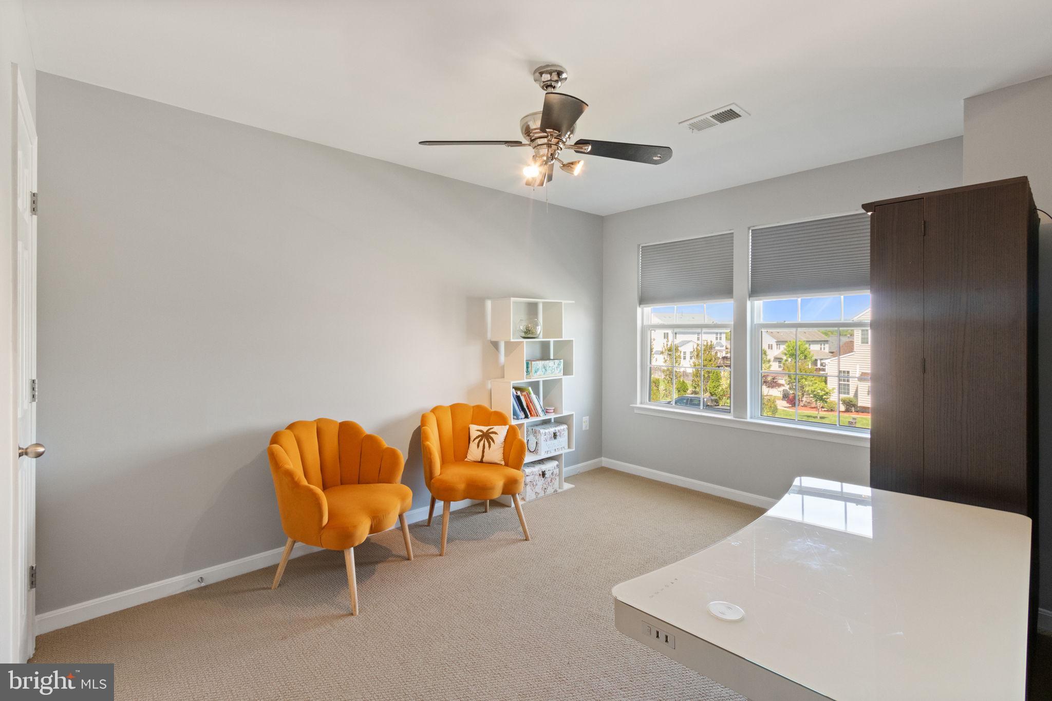 18 Dewitt Road Stafford, VA 22554 - Photo 31 of 73 a living room with furniture and a chandelier