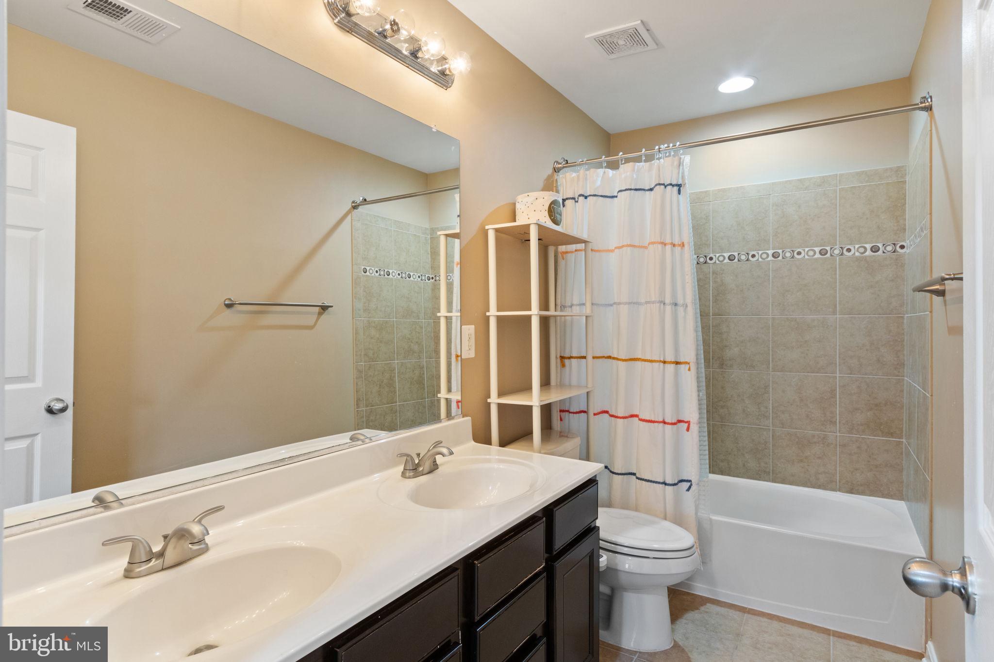 18 Dewitt Road Stafford, VA 22554 - Photo 35 of 73 a bathroom with a sink toilet and shower