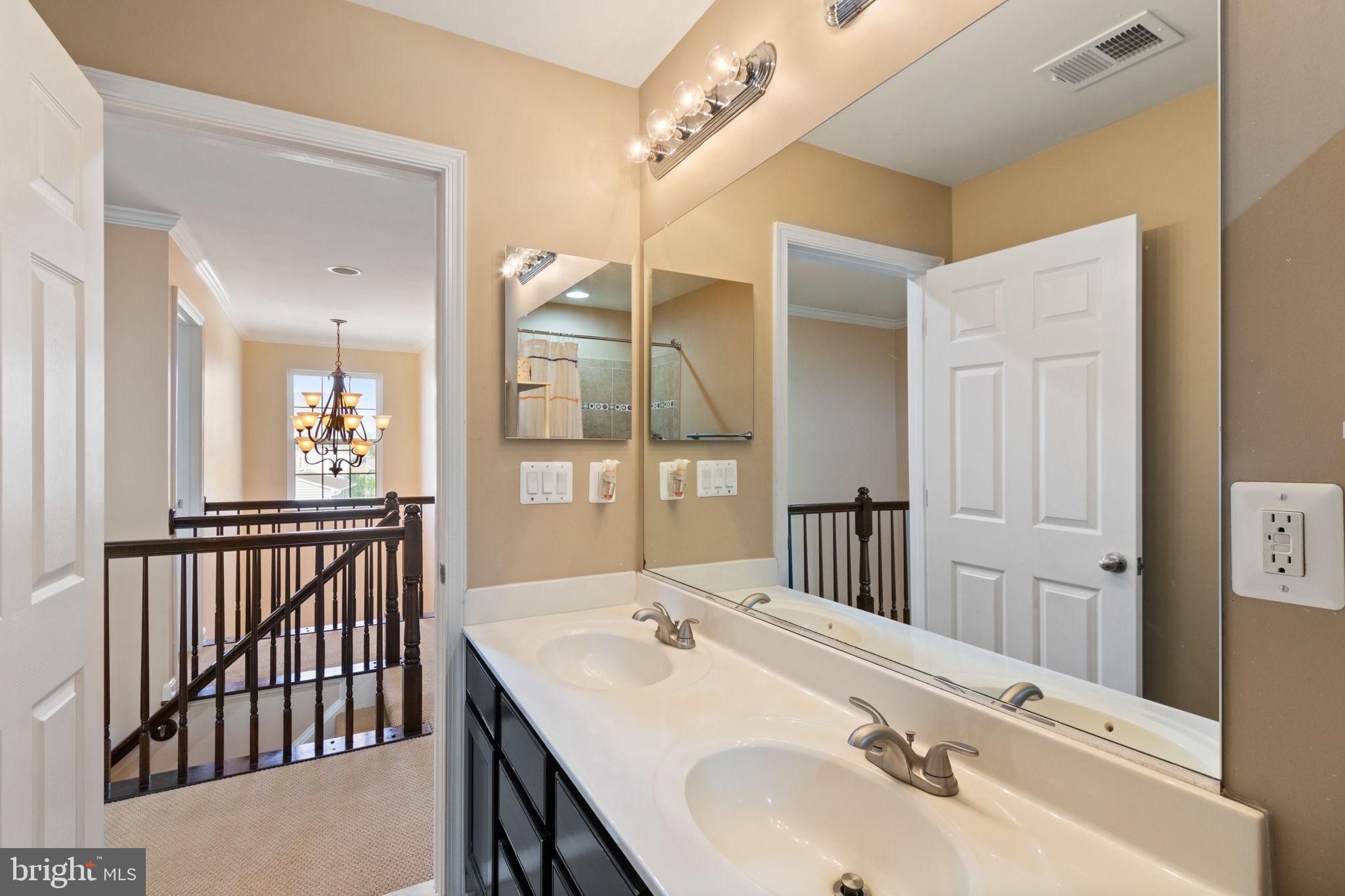 18 Dewitt Road Stafford, VA 22554 - Photo 36 of 73 a bathroom with a sink and a mirror