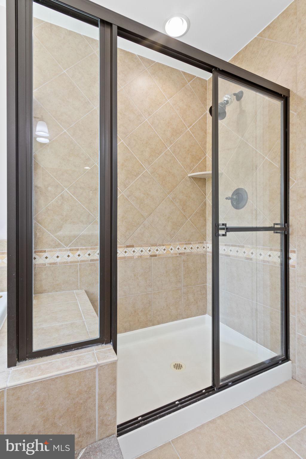 18 Dewitt Road Stafford, VA 22554 - Photo 47 of 73 a bathroom with a glass shower door
