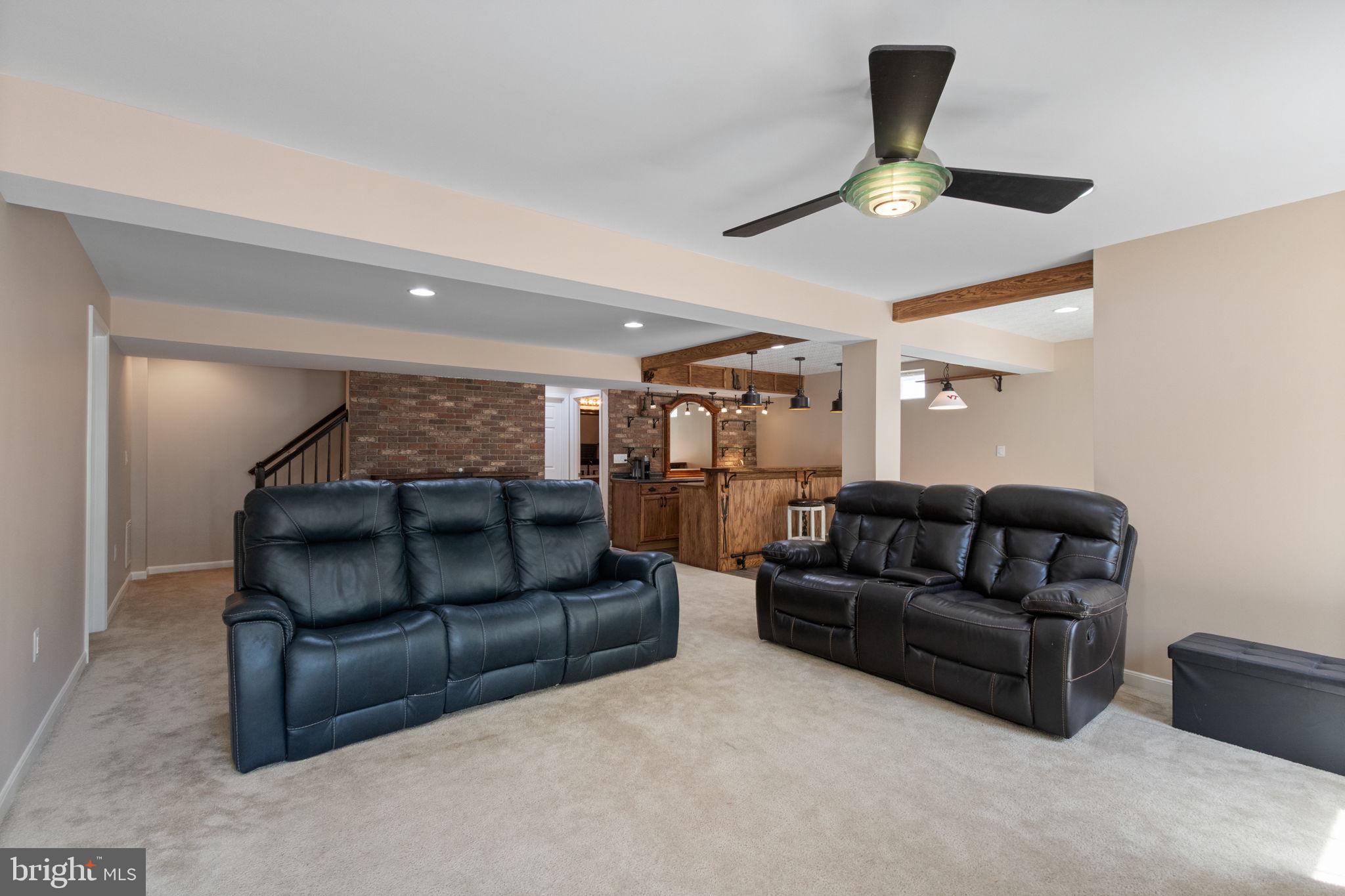 18 Dewitt Road Stafford, VA 22554 - Photo 55 of 73 a living room with furniture and a ceiling fan