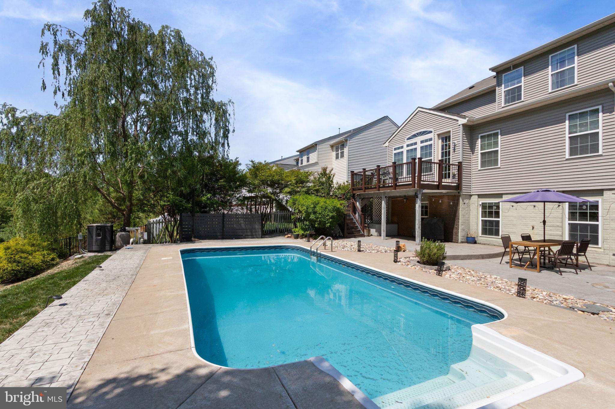 18 Dewitt Road Stafford, VA 22554 - Photo 71 of 73 a view of a house with sitting area and swimming pool