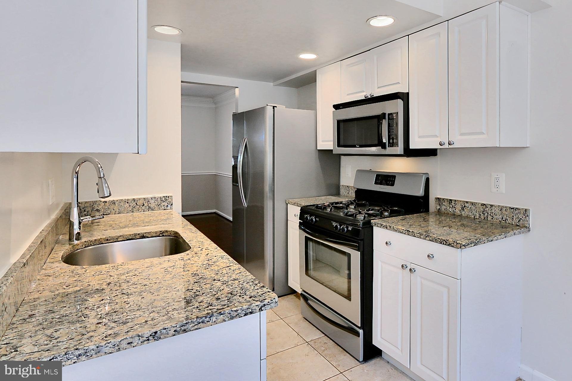 9849 Lakepointe Drive Burke, VA 22015 - Photo 8 of 27 Kitchen w/ Stainless Steel Appliances