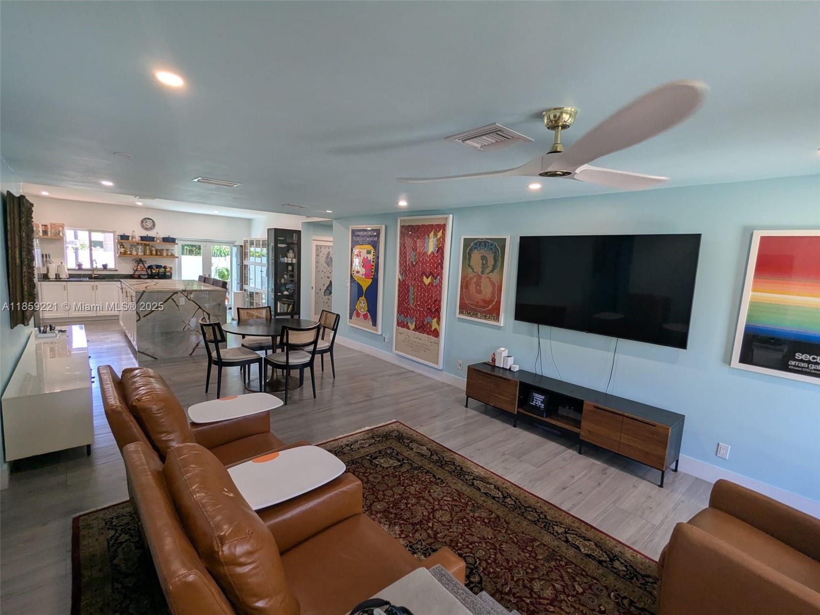 524 Northeast 27th Drive Wilton Manors, FL 33334 - Photo 13 of 95 a living room with furniture and a flat screen tv