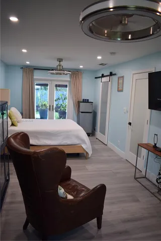 a bathroom with a sink toilet and mirror