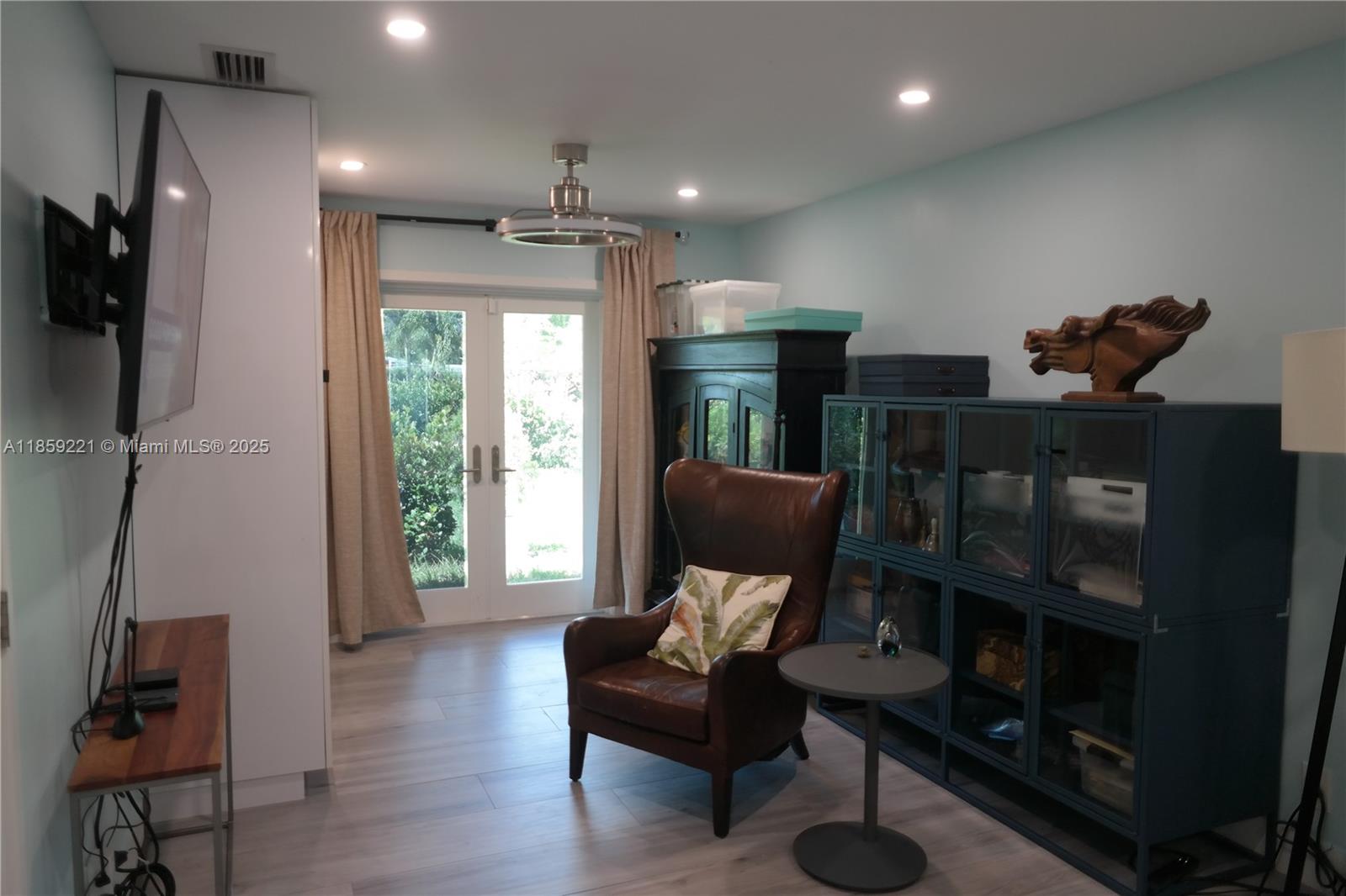 524 Northeast 27th Drive Wilton Manors, FL 33334 - Photo 16 of 95 a living room with furniture and a window