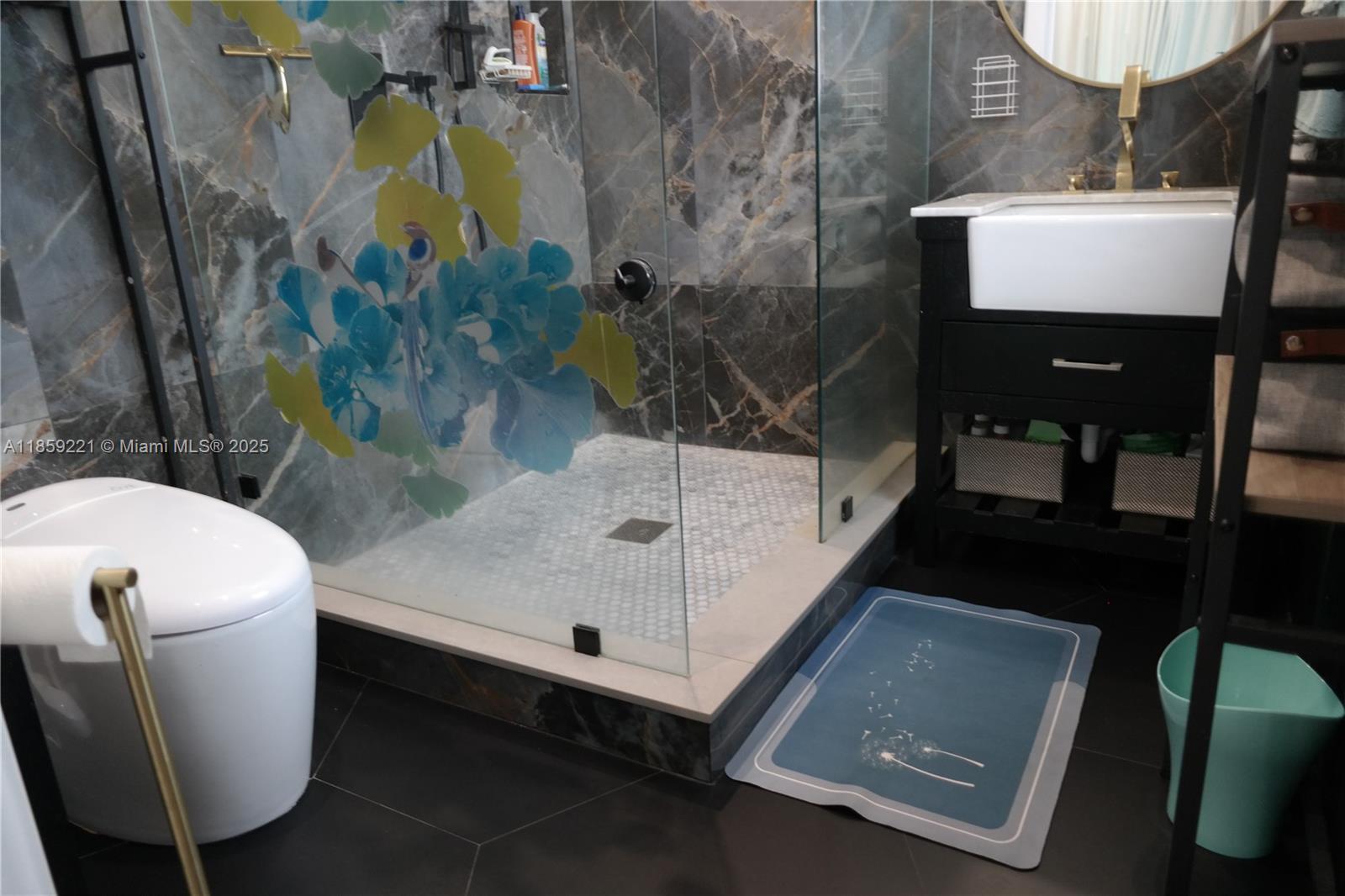 524 Northeast 27th Drive Wilton Manors, FL 33334 - Photo 25 of 95 a bathroom with a sink toilet and mirror