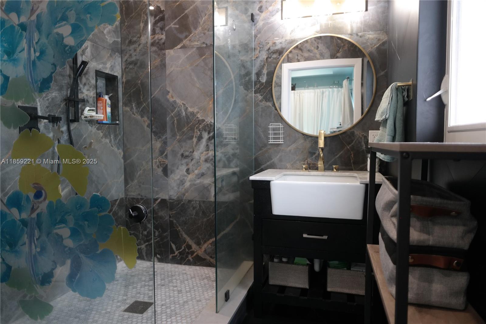 524 Northeast 27th Drive Wilton Manors, FL 33334 - Photo 26 of 95 Sleek en-suite bath with intelligent toilet system and oversized walk-in shower designed for comfort and accessibility